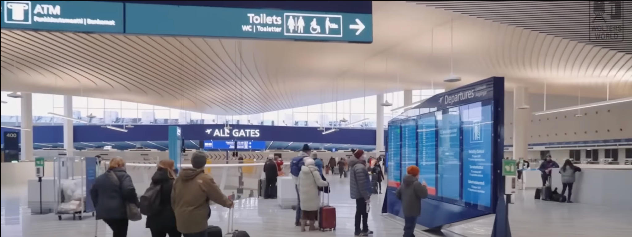 passengers-checking-flight-departure-displays