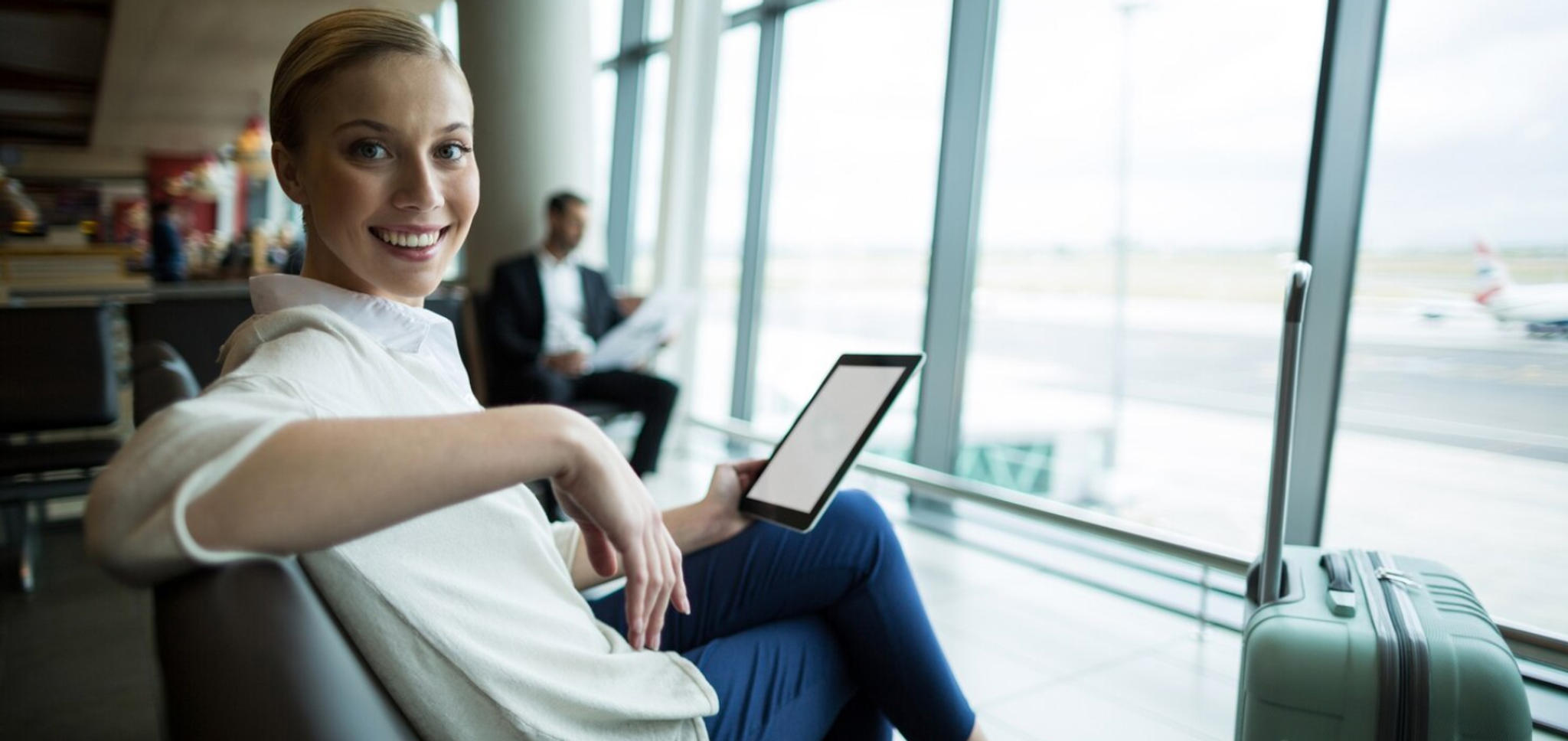 woman-using-airport-wifi-on-tablet