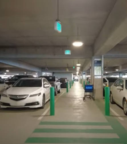 Airport parking garage with multiple levels and parked cars