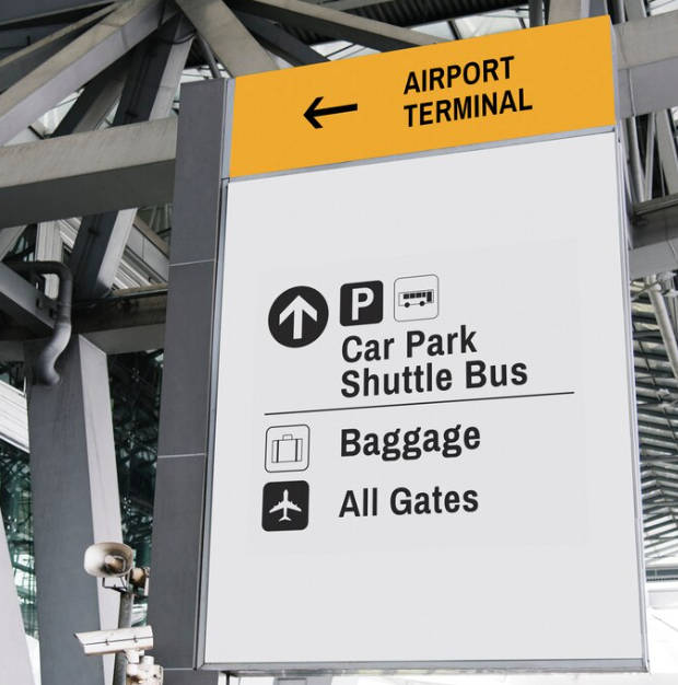 Airport parking signage indicating various parking options and directions