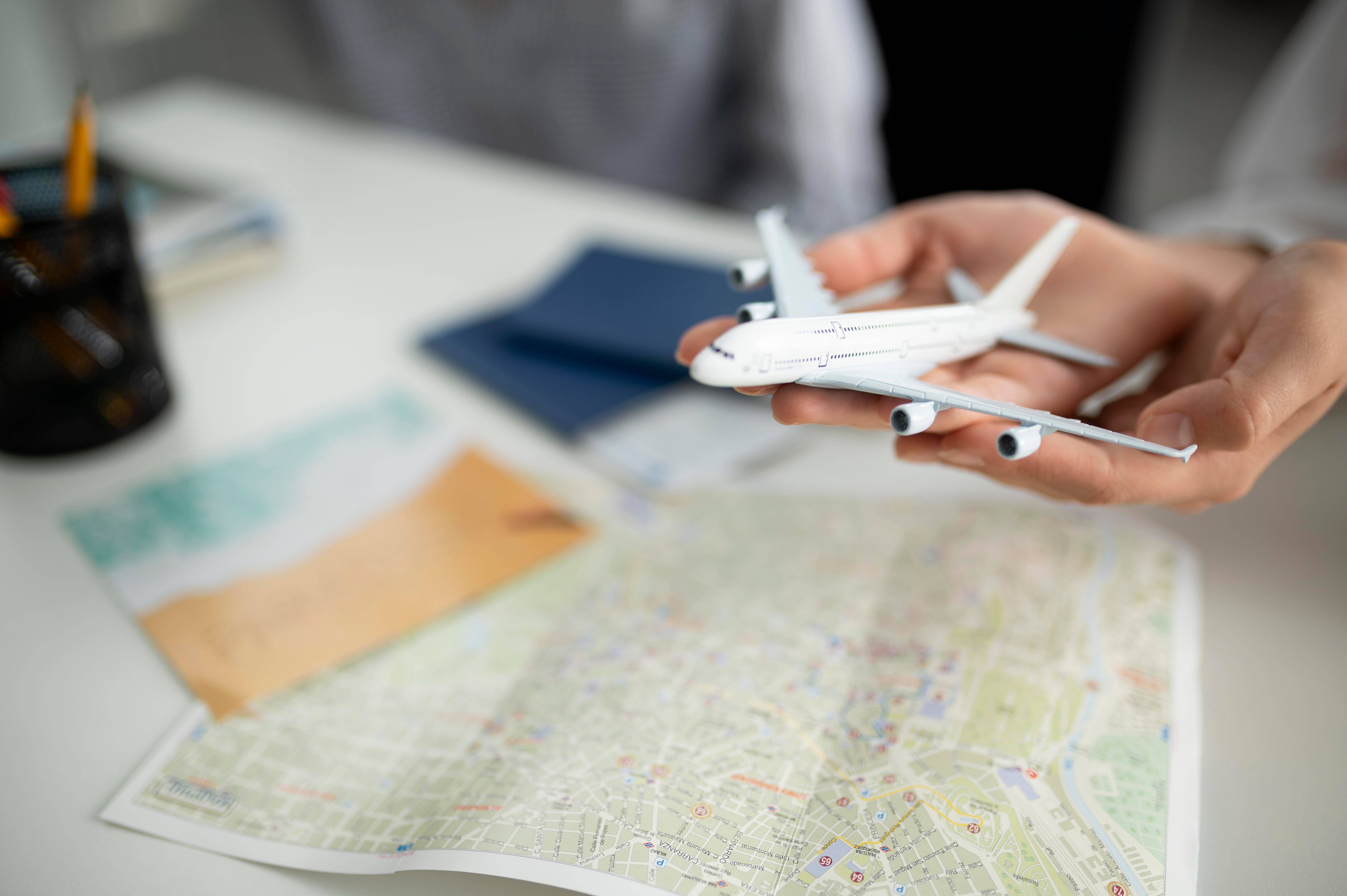 Close up hands holding small plane