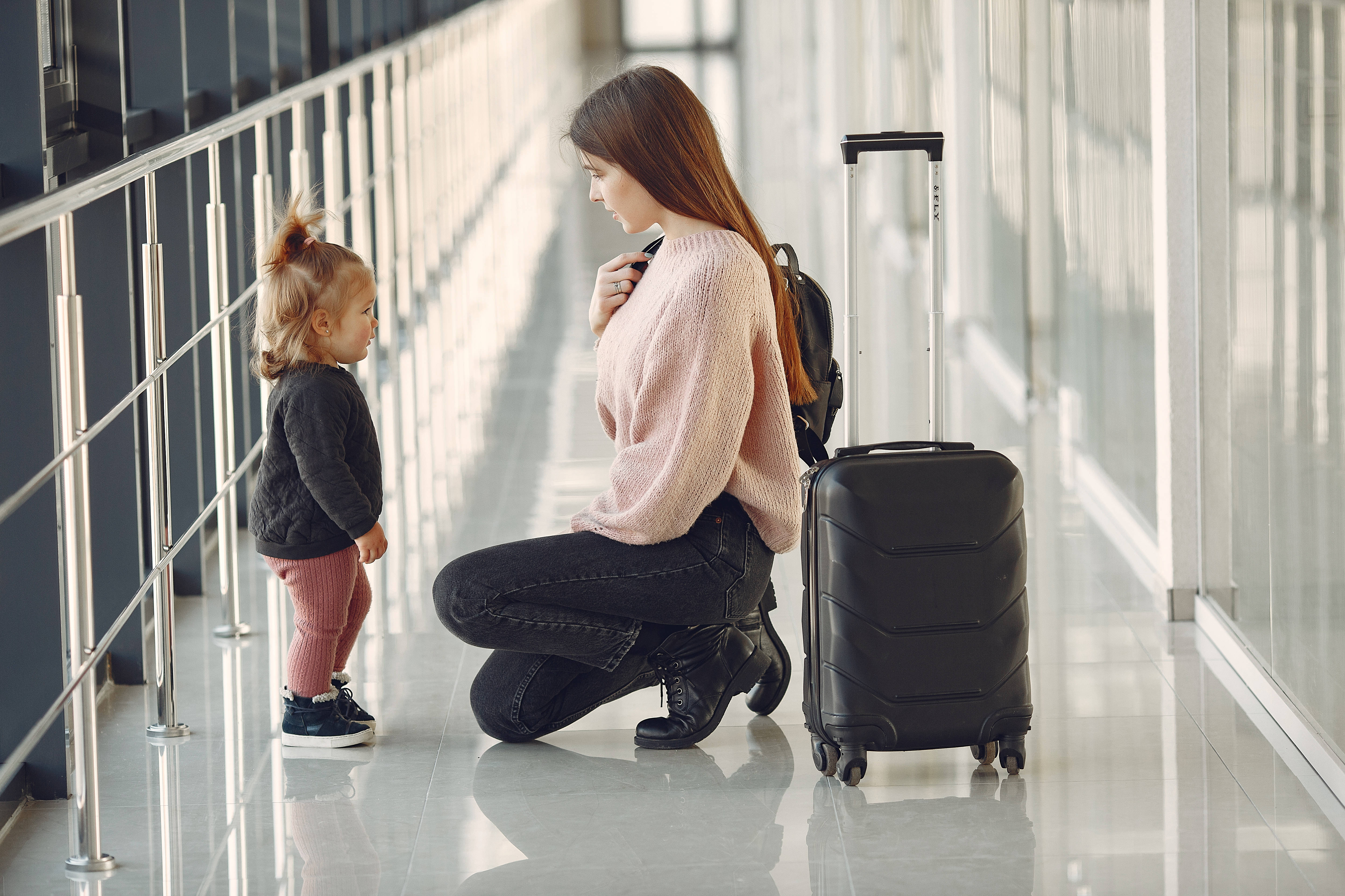 Mother with daughter at the airport