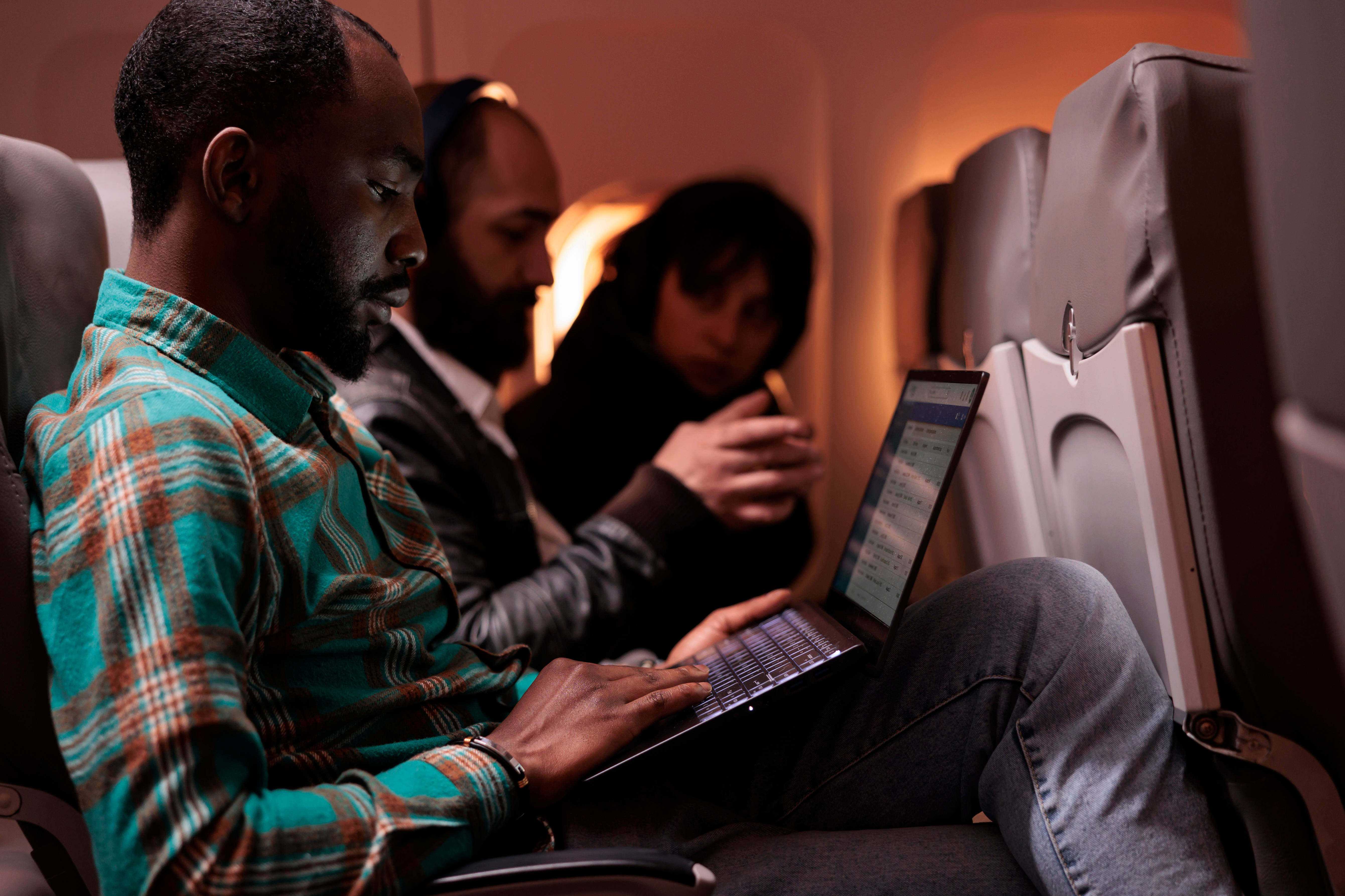 Male passenger travelling abroad by airplane