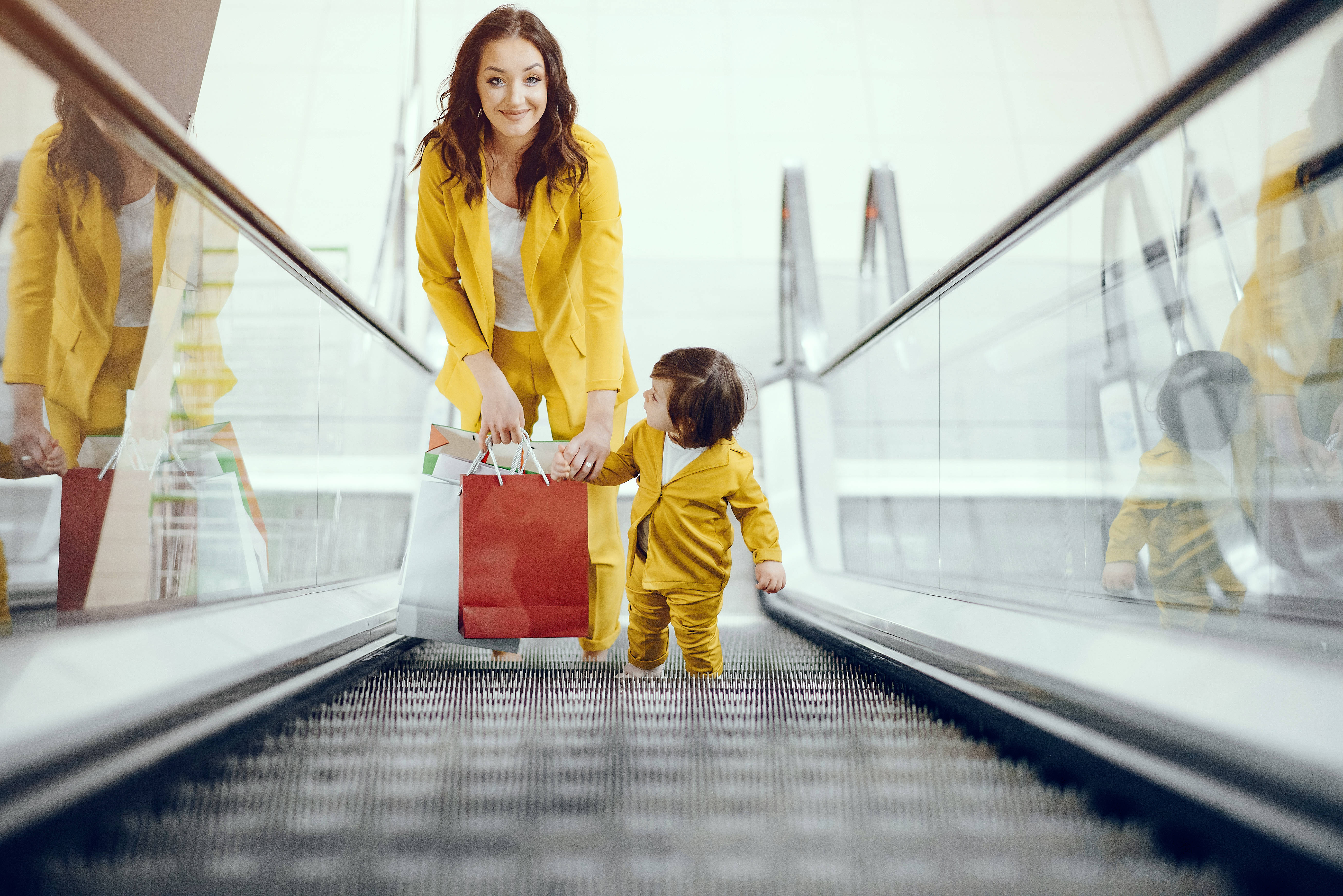 Mother and daughter with shopping bag