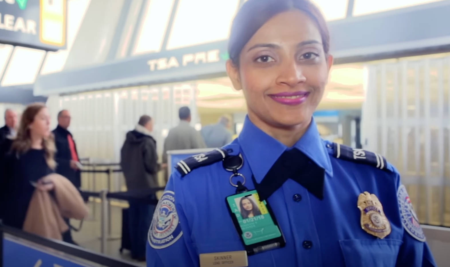 TSA-officer-smiles-at-her-station