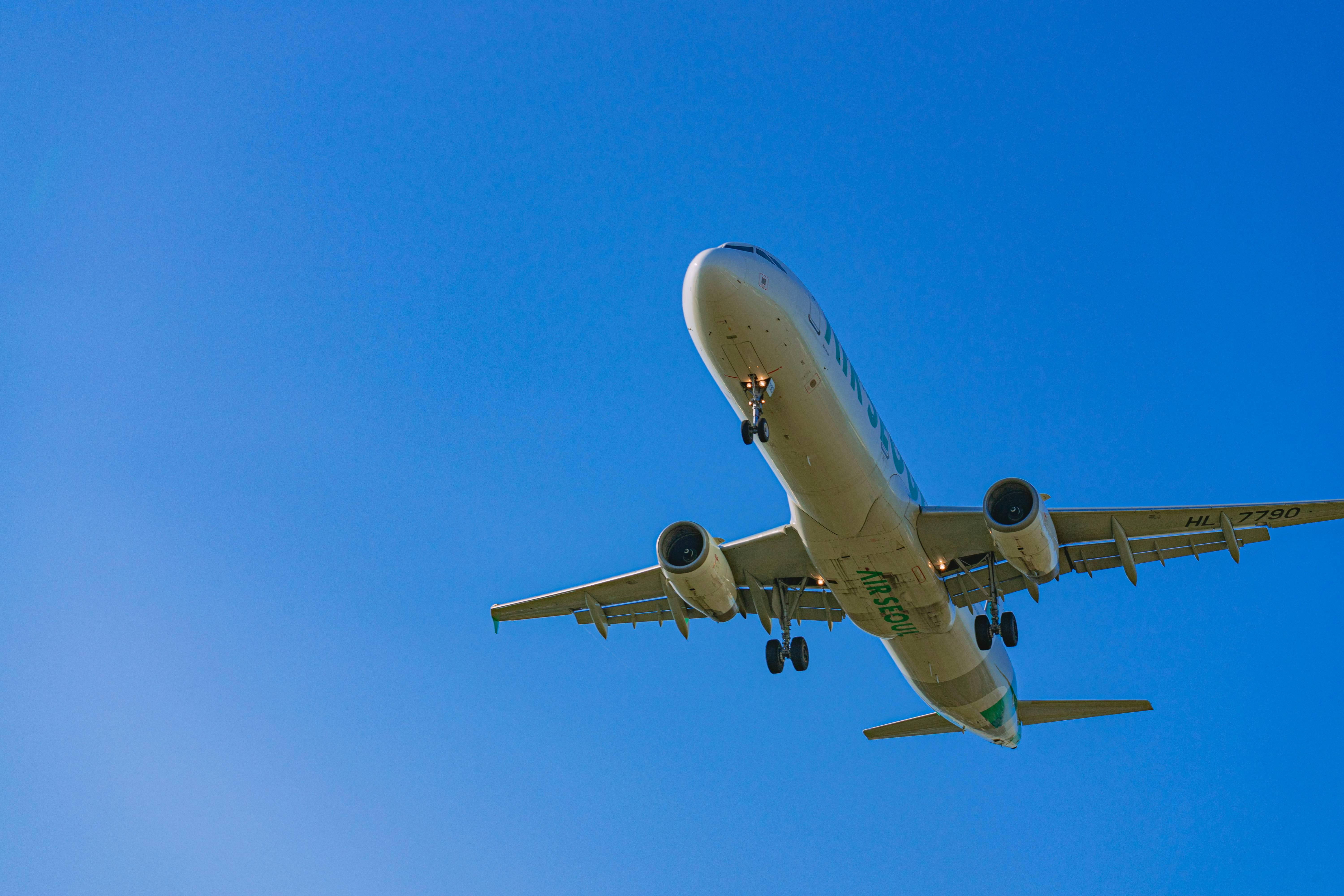 a large passenger jet flying through a blue sky