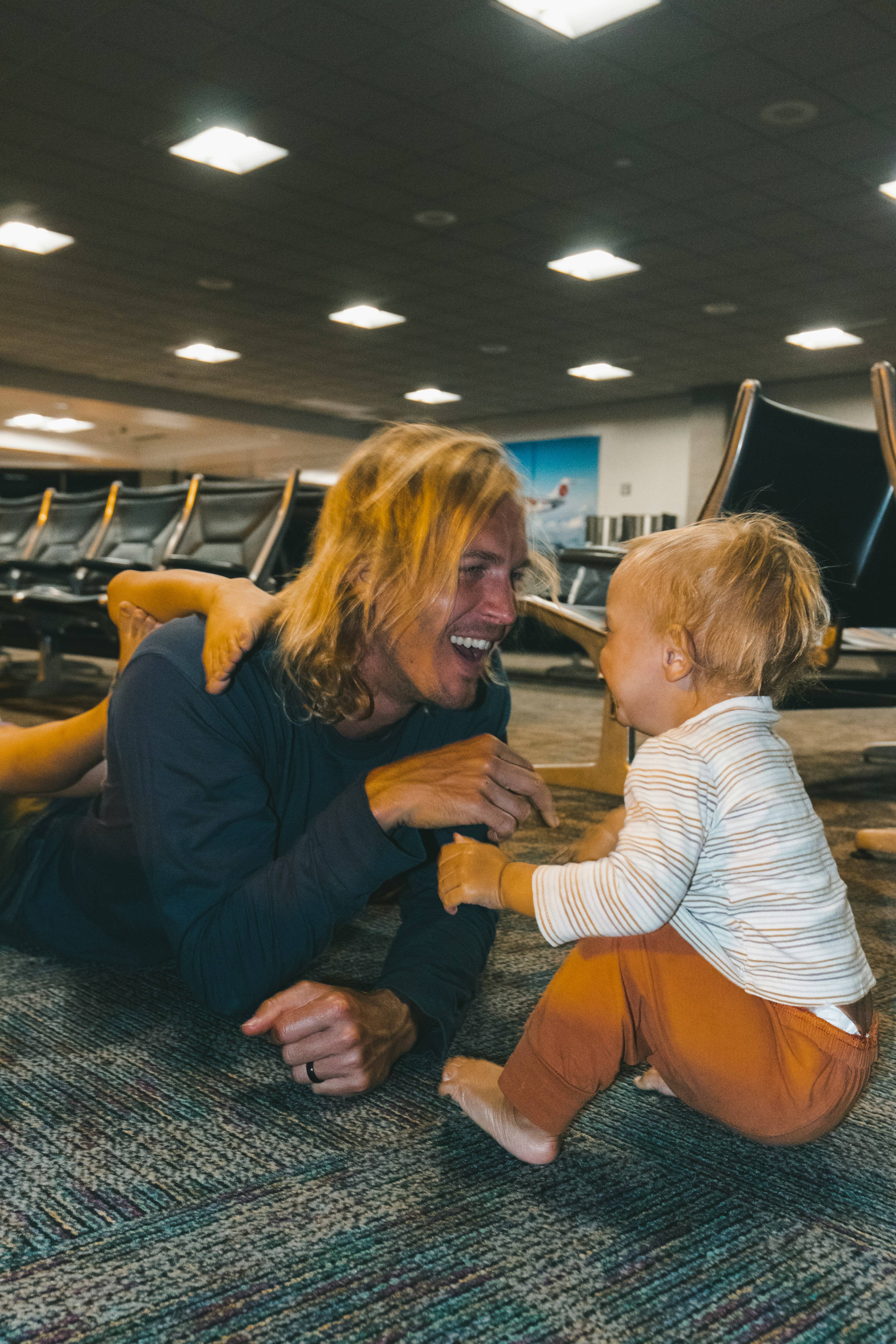 a woman and a child sitting on the floor