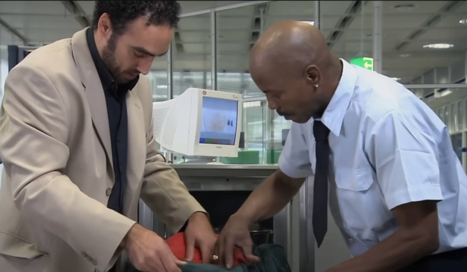 security-agent-inspects-passenger-bag